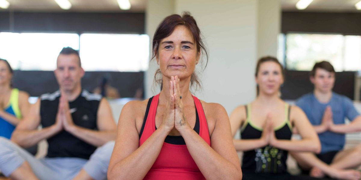 An instructor leading a group of adults during a Rest and Restore class at Christchurch Recreation and Sport centre. 