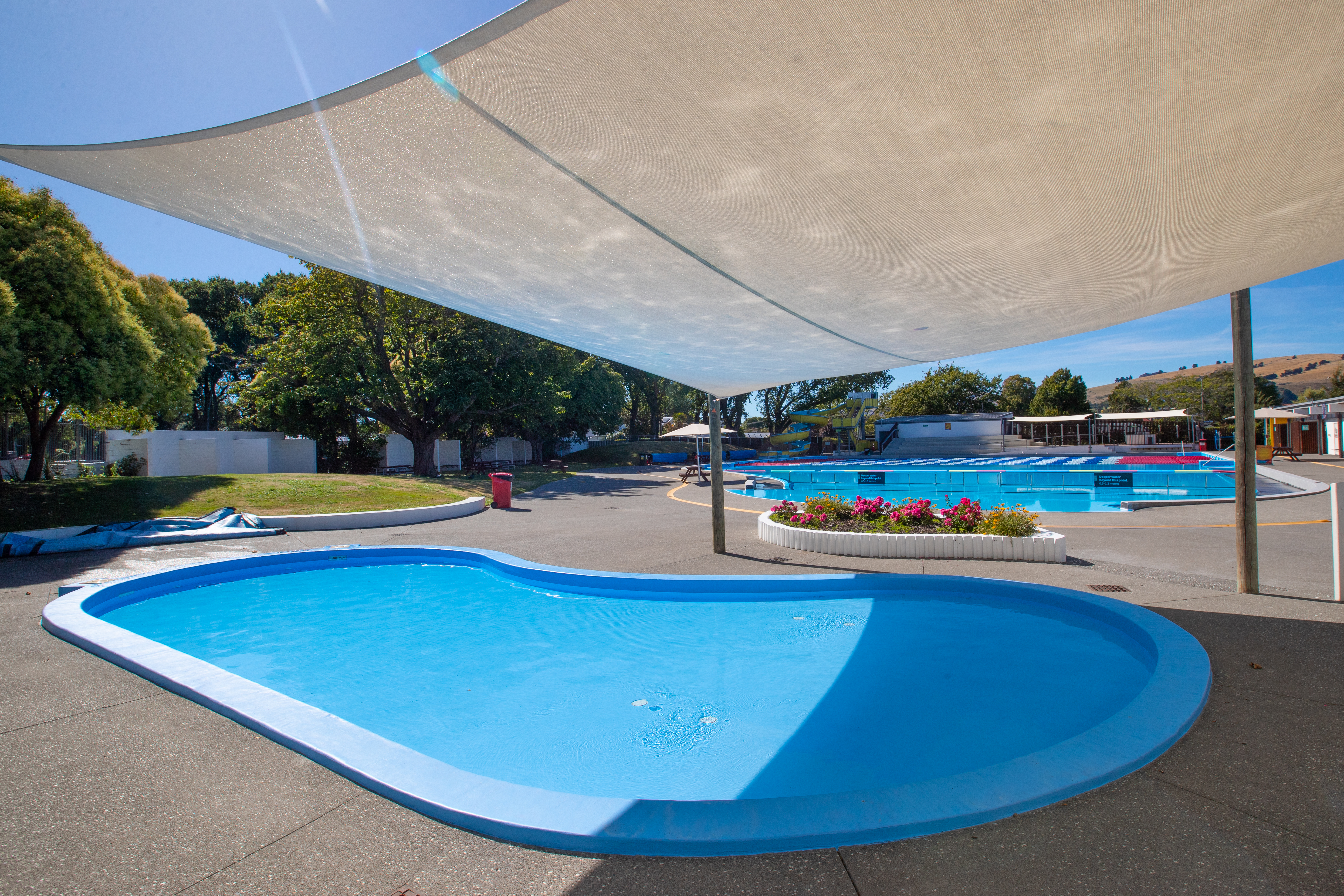 Waltham summer pool with shaded toddler pool. 