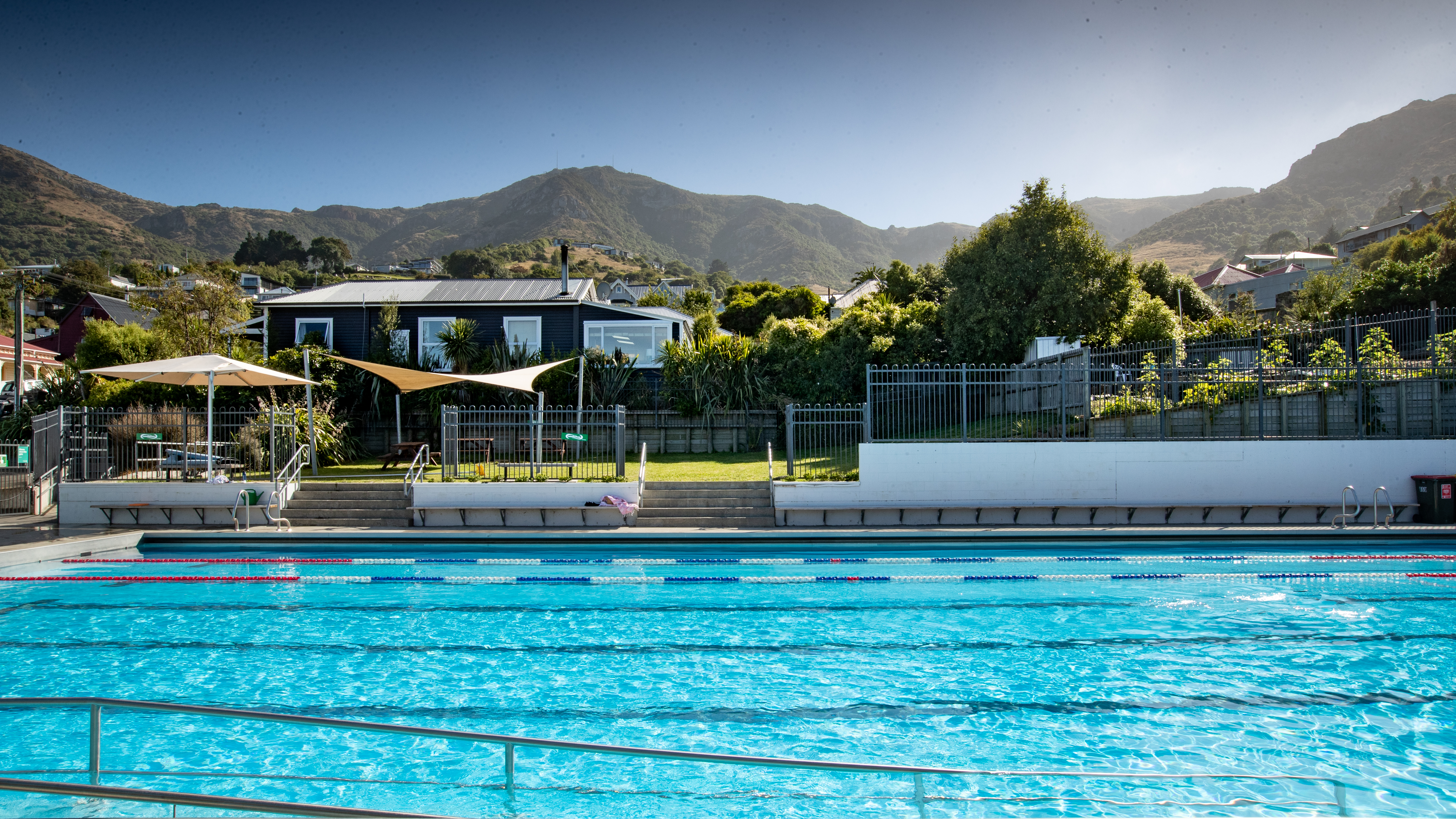 The Norman Kirk summer pool overlooking the Lyttleton Port Hills.  